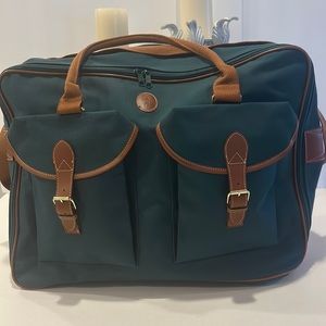 Polo by Ralph Lauren travel bag. Two front pockets and one large center opening